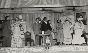 Scene with nine people, 1937.