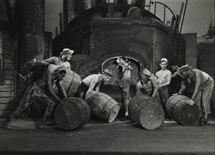 Men moving barrels, 1936.