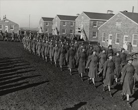 Members of an all-African American company walking in rows during an infantry drill..., 1943. Creator: Unknown.