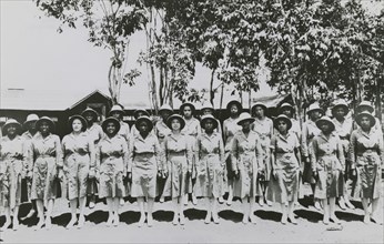 Members of an African American company of the Women's Army Auxiliary Corps lined up for review, Liberia, 1939 - 1945.