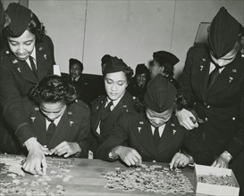 Two African American Lieutenants of the Women's Army Corps sitting at a table and..., 1939 - 1945. Creator: Unknown.