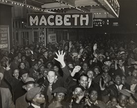 Crowds at the Lafayette Theatre in Harlem at the opening of "Macbeth", 1936.