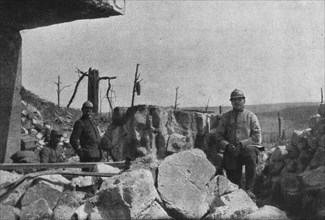 'Autour de Douaumont; au milieu des blocs de beton redoute eventree, un major et ses..., 1916. Creator: Unknown.