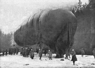 'La "Saucisse"; Avant l'ascension : "-- Sous son ventre ride de gros saurien, pend son…."', 1916. Creator: Unknown.