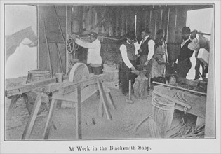 At work in the Blacksmith Shop., 1903. Creator: Unknown.
