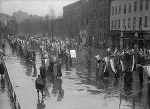 Woman Suffrage - Marching in Rain, 1917. Creator: Harris & Ewing.