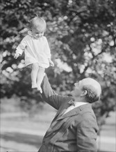 Borglum, Gutzon, Mr., and child, outdoors, 1917 Aug. 18. Creator: Arnold Genthe.