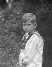 McCormick, Medill, child of, standing outdoors, 1923 May 21. Creator: Arnold Genthe.
