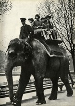 'At the London Zoo - enjoying a ride on an elephant', 1939, (1947).  Creator: Unknown.