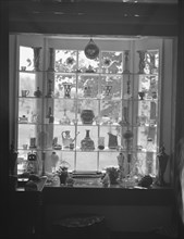 DeLamar, Alice, Miss, house window display, between 1927 and 1942. Creator: Arnold Genthe.