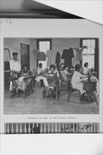 Learning to sew at the Gaudet School; [New Orleans, Louisiana], (1923?). Creator: Unknown.