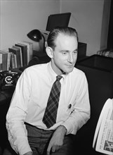 Portrait of Mike Levin, Down Beat office, New York, N.Y., 1946. Creator: William Paul Gottlieb.