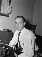 Portrait of Mike Levin, Down Beat office, New York, N.Y., ca. 1947. Creator: William Paul Gottlieb.