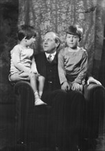 Unidentified man and two children, portrait photograph, between 1911 and 1942. Creator: Arnold Genthe.
