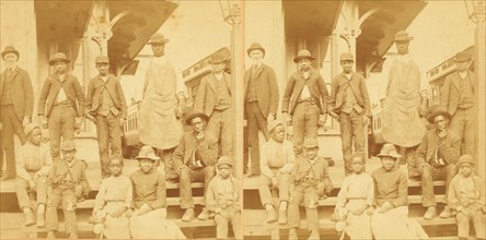 Simplicity, Alabama, U.S.A. [Group gathered on a porch, in town], (1868-1900?). Creator: Benjamin West Kilburn.