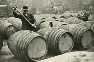 There Are a Quarter of a Million Gallons of Port in the Port Vaults - Wine Gauging Ground', 1937. Creator: Fox.