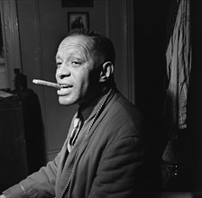 Portrait of Willie Smith in his apartment, Manhattan, New York, N.Y., ca. Jan. 1947. Creator: William Paul Gottlieb.