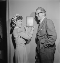 Portrait of Melvin G. Powell and Martha Scott in their home, Connecticut, ca. May 1947. Creator: William Paul Gottlieb.