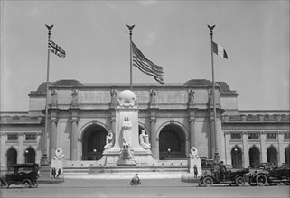 Flags - American, British, And French Flags in Front of Union Station, Awaiting Arrival..., 1917. Creator: Harris & Ewing.