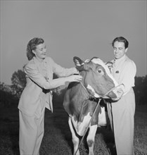 Portrait of Enric Madriguera and Patricia Gilmore on their farm, Connecticut, ca. June 1947. Creator: William Paul Gottlieb.