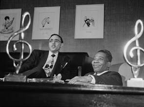 Portrait of Bernie Benjamin and George (George David) Weiss in their office, N.Y., ca. Apr. 1947. Creator: William Paul Gottlieb.