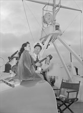 Portrait of Frank Raye and Betty Brewer, Ukelele Lady (yacht), Hudson River, N.Y., ca. June 1947. Creator: William Paul Gottlieb.