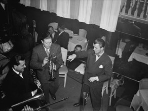 Portrait of Tony Parenti, Wild Bill Davison, and Eddie Condon, Eddie Condon's, N.Y., ca. June 1946. Creator: William Paul Gottlieb.