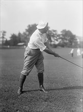Joseph Edward Davies, Chairman, Federal Trade Commission. Playing Golf, 1917. Creator: Harris & Ewing.