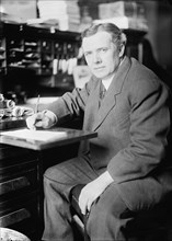 David John Lewis, Rep. from Maryland, U.S. Tariff Commn, at Desk, 1913. Creator: Harris & Ewing.