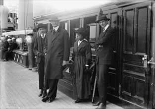 William Gibbs McAdoo, Secretary of The Treasury, Mrs. Albert Sidney Burleson; Target Practice, 1913. Creator: Harris & Ewing.