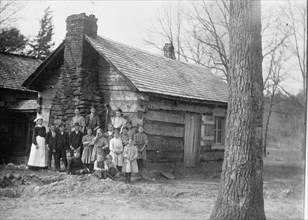 Mountaineers Cabin And Family of 15, 1913. Creator: Harris & Ewing.