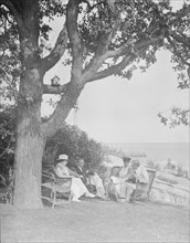 Cosgrave group seated outdoors, 1917 Creator: Arnold Genthe.