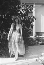 Barnett, Sally, Miss, standing outdoors, 1927 Creator: Arnold Genthe.