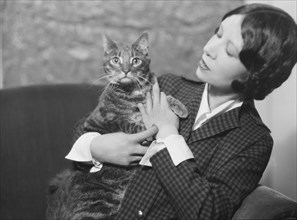 Cumner, Gwendolyn, Miss, with cat (possibly Pudge), portrait photograph, 1928 Creator: Arnold Genthe.