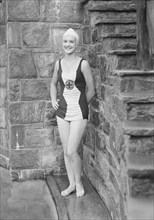 Ford, Elsie, Miss, standing outdoors in a bathing suit, 1932 July. Creator: Arnold Genthe.