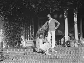 King, Hamilton, Mr. and Mrs., seated on the steps of their home, 1932 or 1933. Creator: Arnold Genthe.