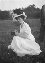 Rainsford, Mrs., seated outdoors, between 1922 and 1924. Creator: Arnold Genthe.