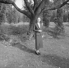 Ruth, standing outdoors by a tree, 1936 Creator: Arnold Genthe.