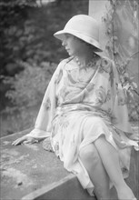 Stettheimer, Florine, Miss, seated outdoors, 1931 Aug. 19. Creator: Arnold Genthe.
