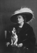 Brooks, Anita, Miss, with dog, portrait photograph, 1917 or 1918. Creator: Arnold Genthe.