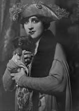 Cowl, Jane, Miss, with dog, portrait photograph, 1918 Oct. 14. Creator: Arnold Genthe.