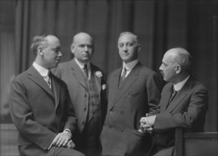 Esberg, Mr., Mr. Melton, and two unidentified men, portrait photograph, 1915 Jan. Creator: Arnold Genthe.
