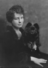 Hartshorne, Miss, with dog, portrait photograph, 1917 May 15. Creator: Arnold Genthe.
