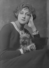Melville, Mrs., with dog, portrait photograph, not before 1916. Creator: Arnold Genthe.