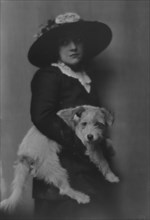 Taylor, Laurette, Miss, with dog, portrait photograph, 1913. Creator: Arnold Genthe.