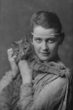 Holch, Anna, Miss, with Buzzer the cat, portrait photograph, ca. 1913. Creator: Arnold Genthe.