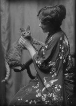 Warren, Gertrude, Miss, or Miss Jackman, with Buzzer the cat, portrait photograph, 1912 or 1913. Creator: Arnold Genthe.