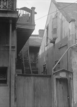 Houses in the French Quarter, New Orleans, between 1920 and 1926. Creator: Arnold Genthe.