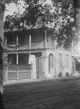 View from across street of a multi-story house, [25 Franklin Street], Charleston..., c1920-1926. Creator: Arnold Genthe.