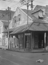 Corner store in the French Quarter, New Orleans, between 1920 and 1926. Creator: Arnold Genthe.